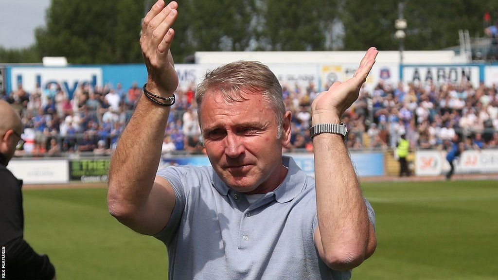 Paul Simpson celebrates his side's reaching the League Two play-off final