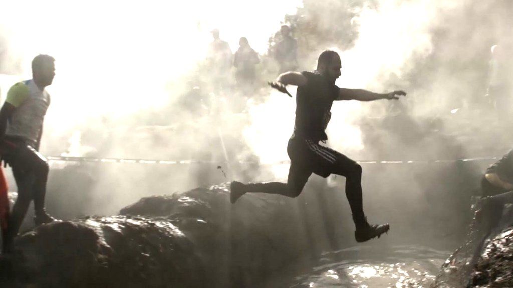 Mud, sweat and cheers: The rise of obstacle course racing - BBC News