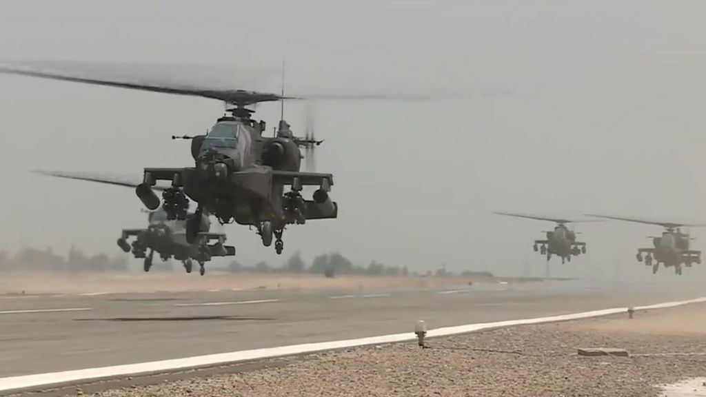 An image grab taken from a handout video released by the Egyptian Defence Ministry on 25 November 2017 shows US-made Egyptian army Apache attack helicopters flying from an airfield