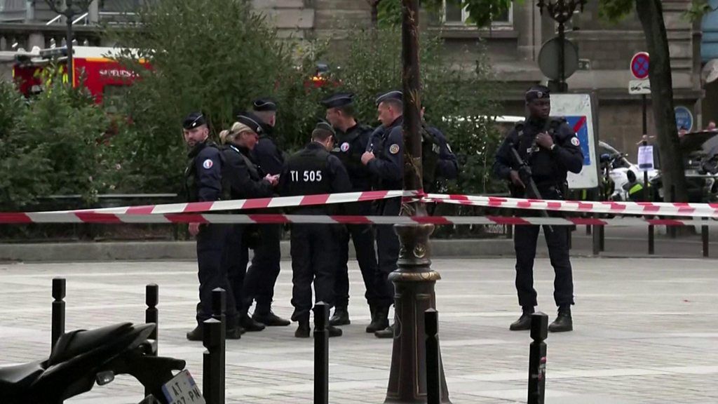 Officers outside police headquarters in Paris