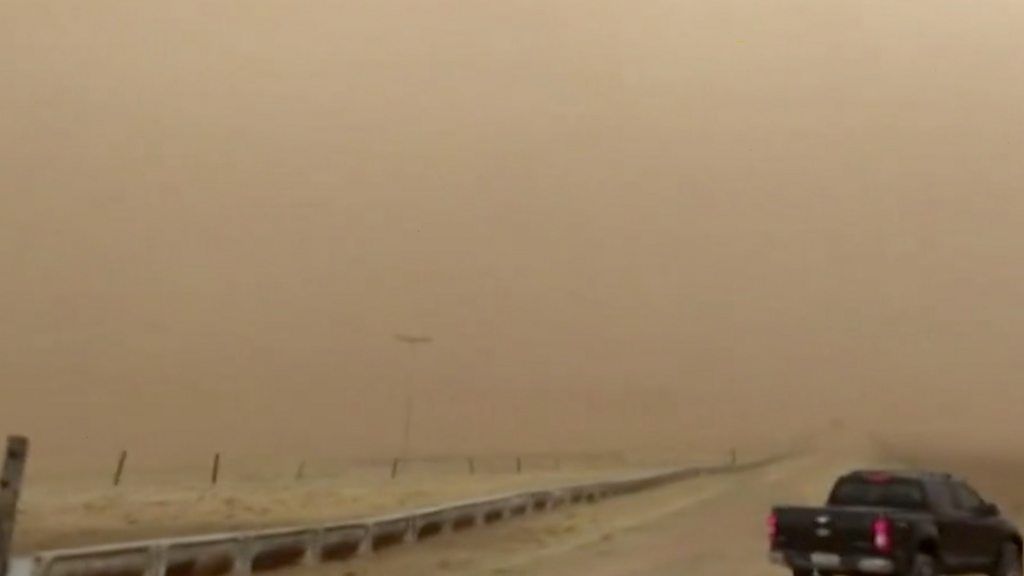 A car in a sandstorm in Sao Paulo, Brazil