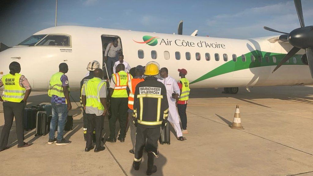 An Air Cote d'Ivoire plane on the tarmac at Banjul airport
