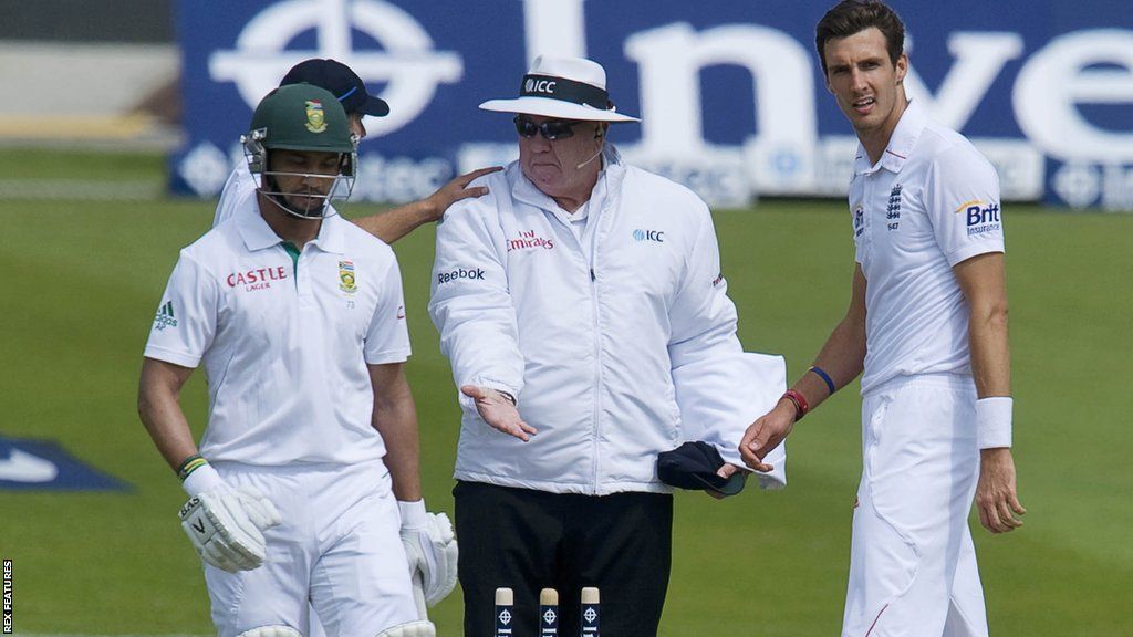 Steven Finn falls foul of Australian umpire Steve Davis after knocking into the stumps during the second Test with South Africa at Headingley in 2012