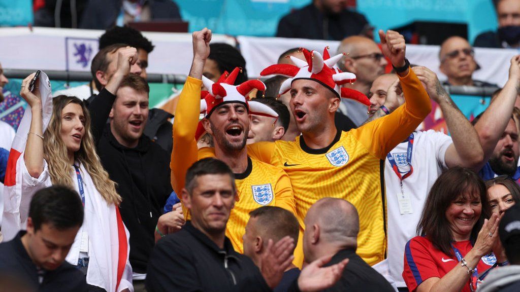 Fans cheering at Wembley stadium