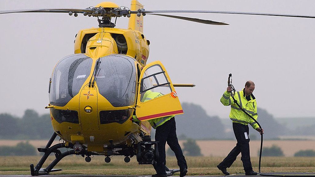 Prince William alongside air ambulance