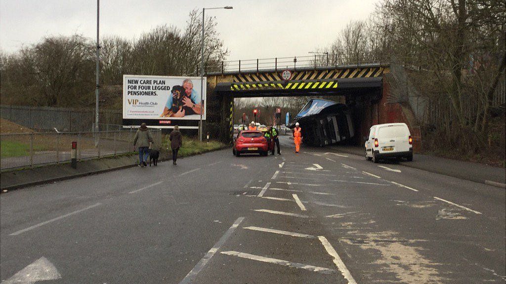 Delays as lorry gets stuck under railway bridge in Swindon BBC News