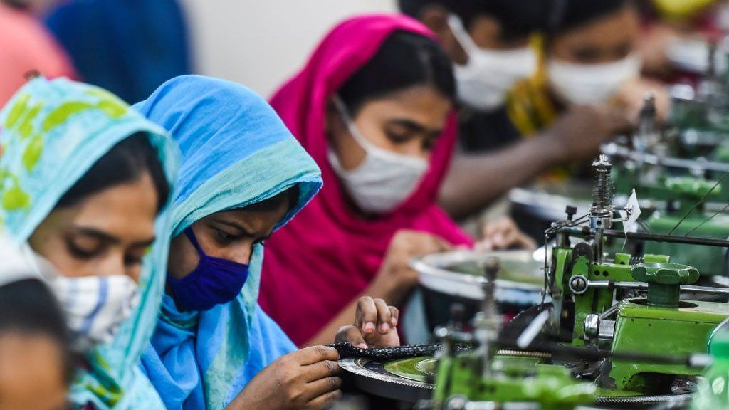 Labourers work in a garment factory during a government-imposed lockdown as a preventative measure against the spread of the COVID-19 coronavirus.