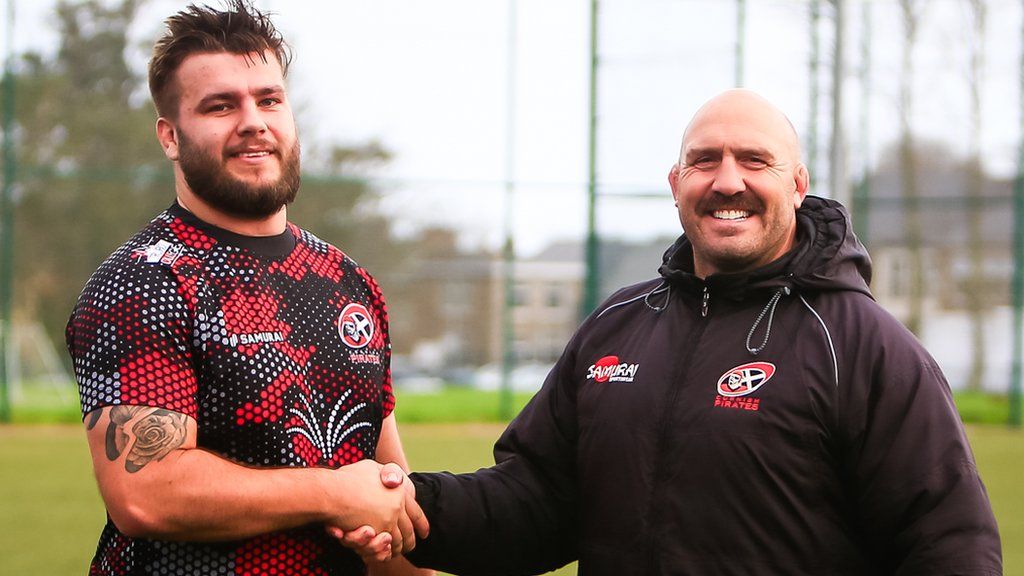 Billy Young (left) shakes hands with Cornish Pirates coach Alan Paver