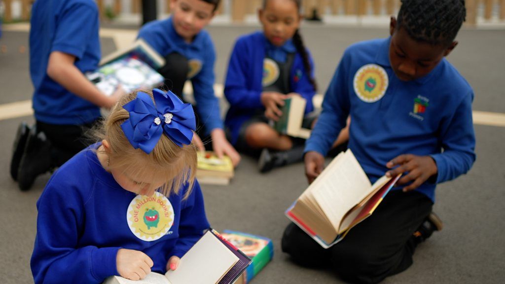 Schoolchildren reading books as part of Children's Book Project UK
