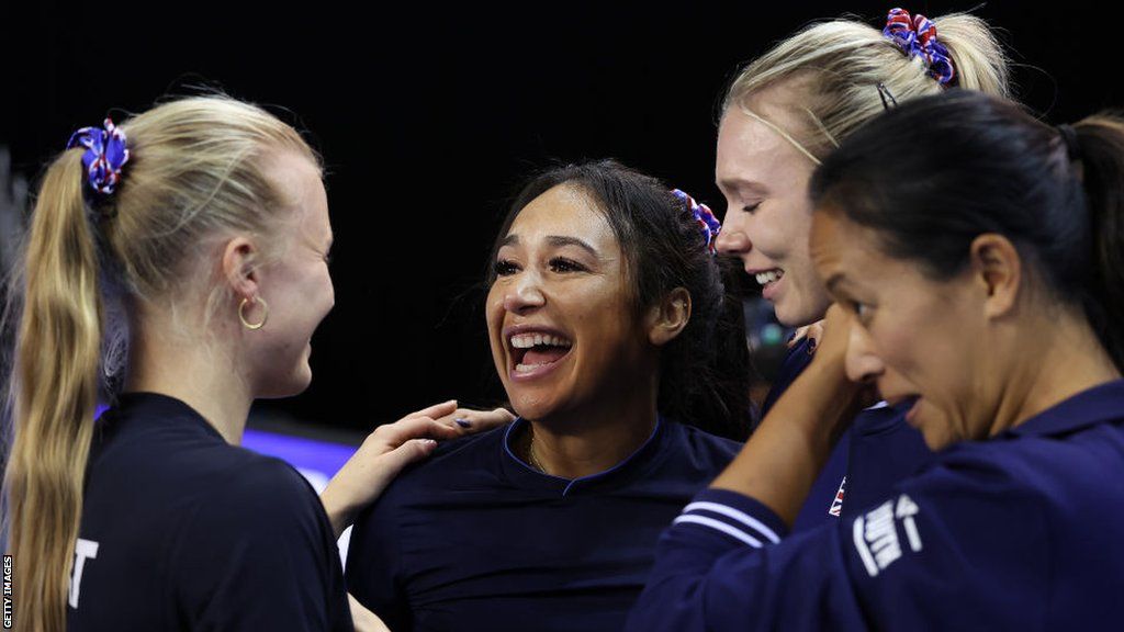 Great Britain players Harriet Dart, Heather Watson and Katie Boulter, along with captain Anne Keothavong, celebrate their BJK Cup win against Spain in 2022