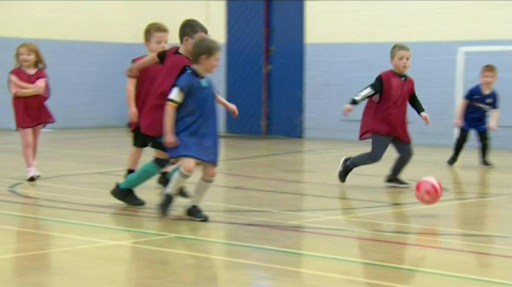 Kids playing football