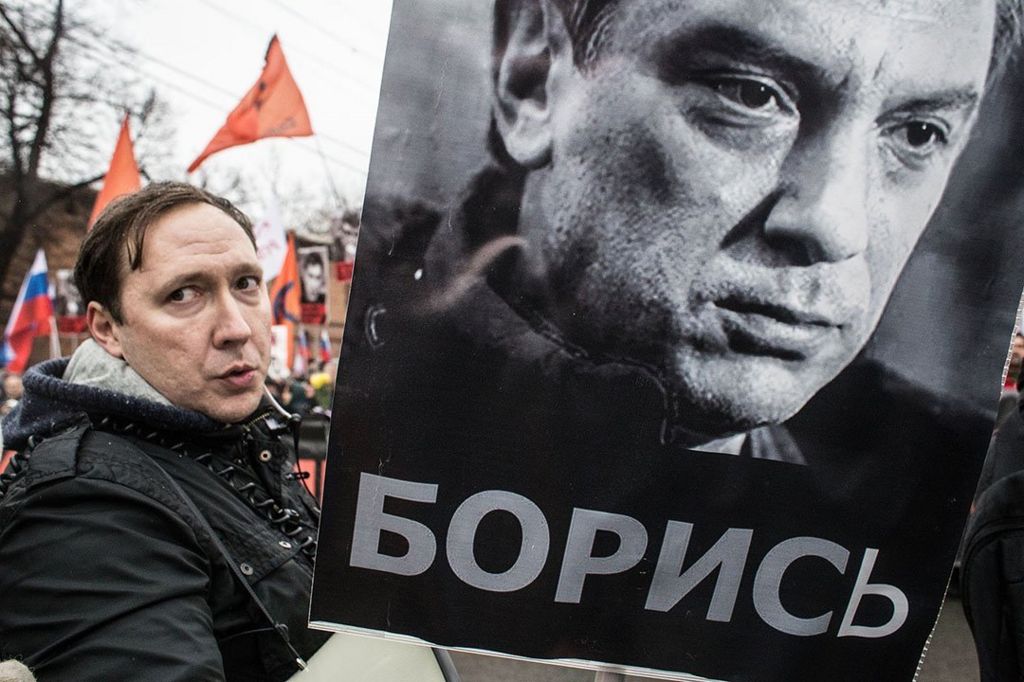 People march in memory of Russian opposition leader and former Deputy Prime Minister Boris Nemtsov on March 01, 2015 in central Moscow, Russia. Nemtsov was murdered on Bolshoi Moskvoretsky bridge near St. Basil cathedral just few steps from the Kremlin on February 27 (Photo by Alexander Aksakov/Getty Images)
