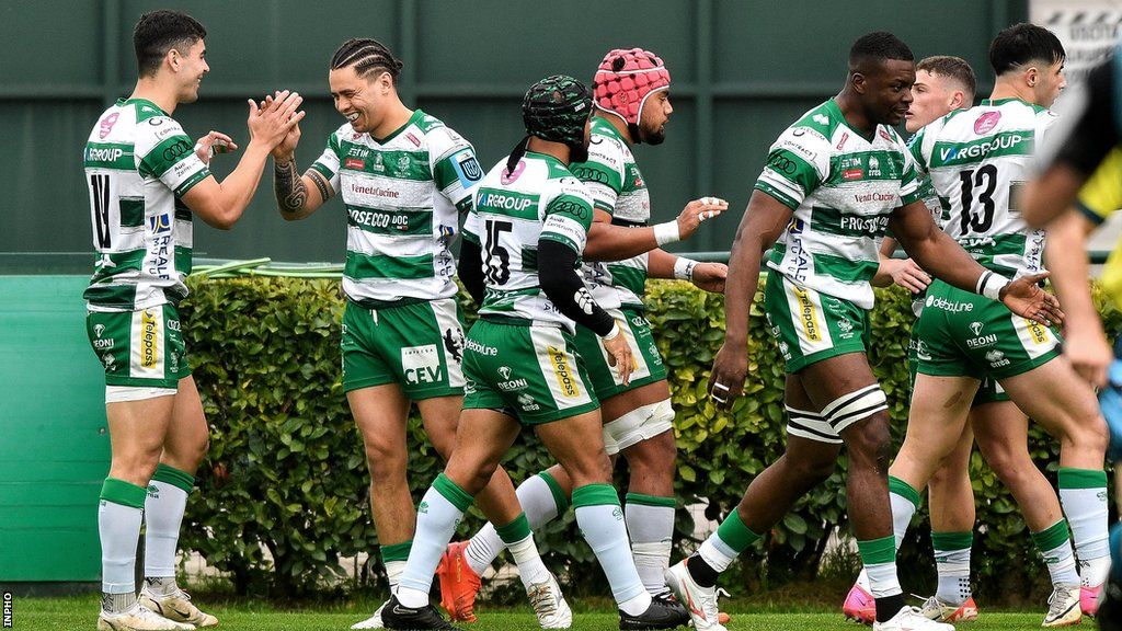Ignacio Mendy celebrates with team-mates after scoring a try
