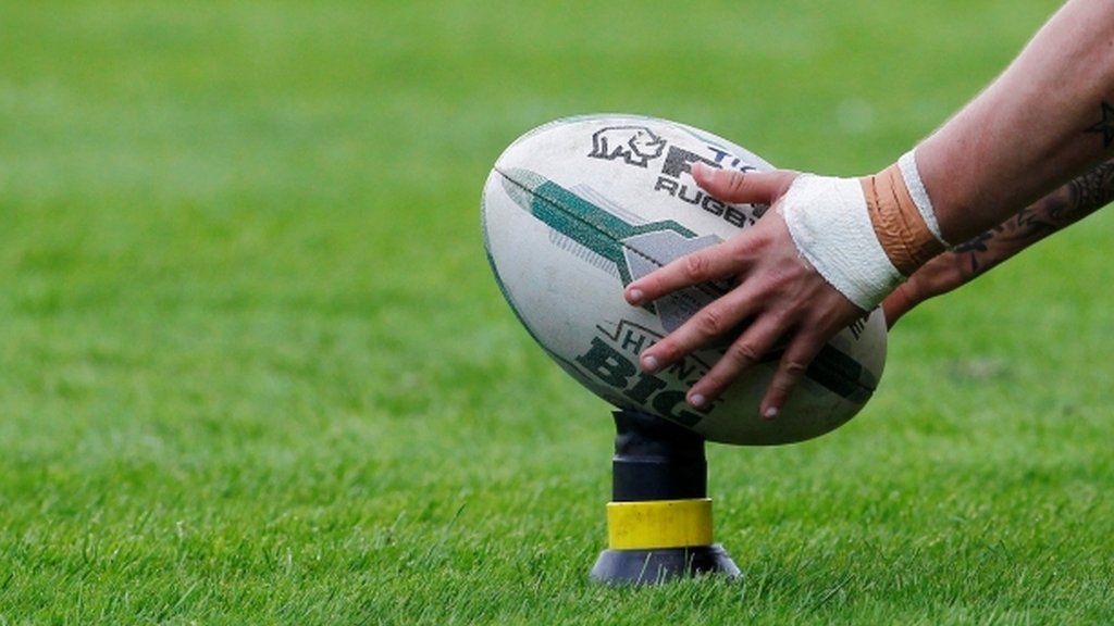 Rugby league ball on a kicking tee
