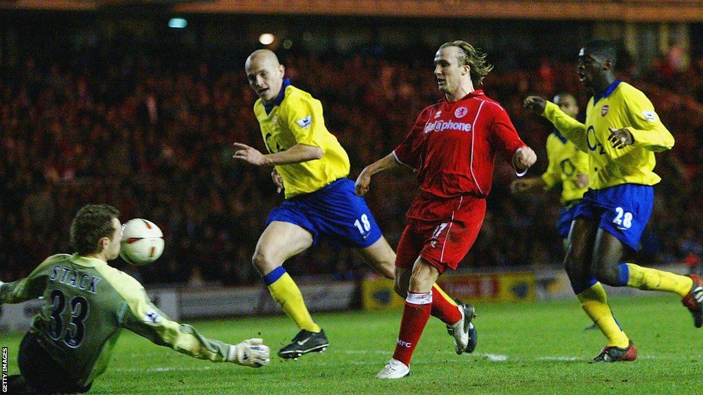 Boudewijn Zenden clips the ball over Graham Stack to put Middlesbrough further ahead in the League Cup semis