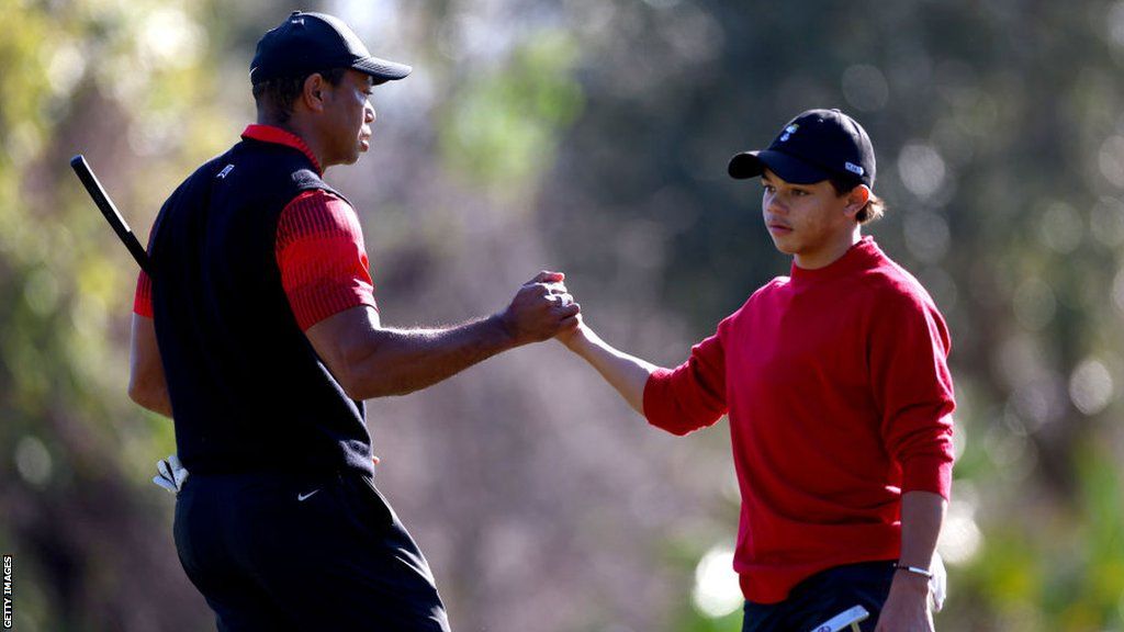 Charlie Woods with his father Tiger Woods