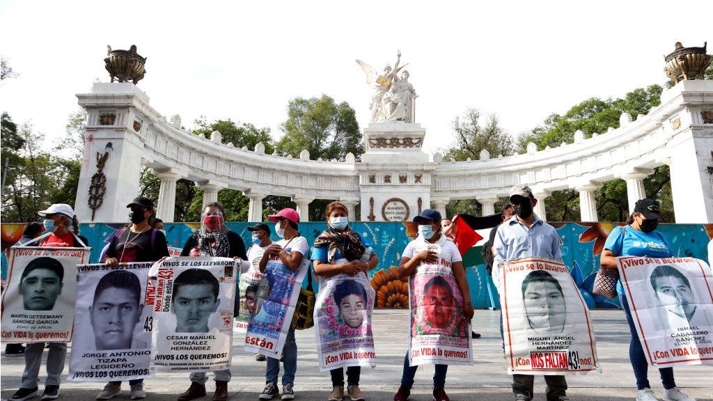 Relatives of the missing of 43 Ayotzinapa normalistas student from Iguala, in the state of Guerrero, take part during a march at Reforma Avenue, to demand justice for the crime happened in 2014.