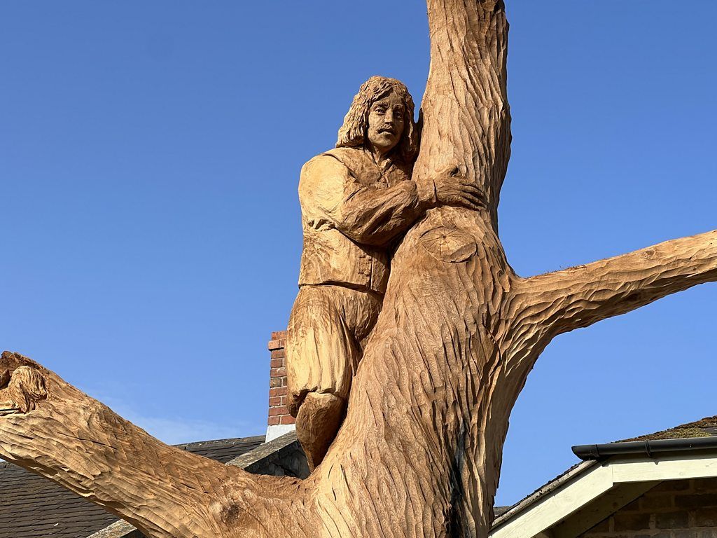 Sculpture of Charles II hanging onto a tree
