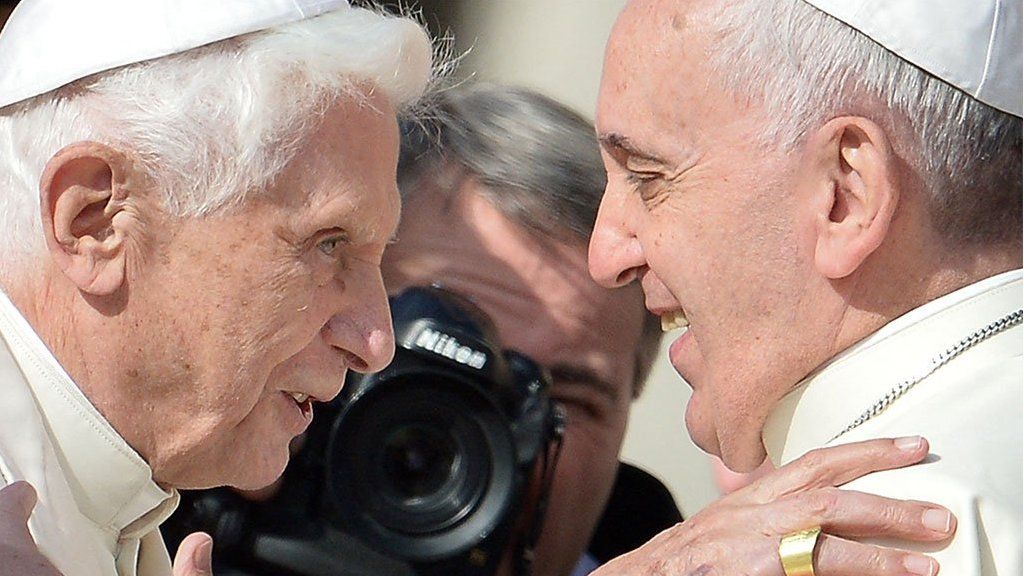 Pope Emeritus Benedict XV is welcomed by Pope Francis at St Peter's square, Vatican, 2014