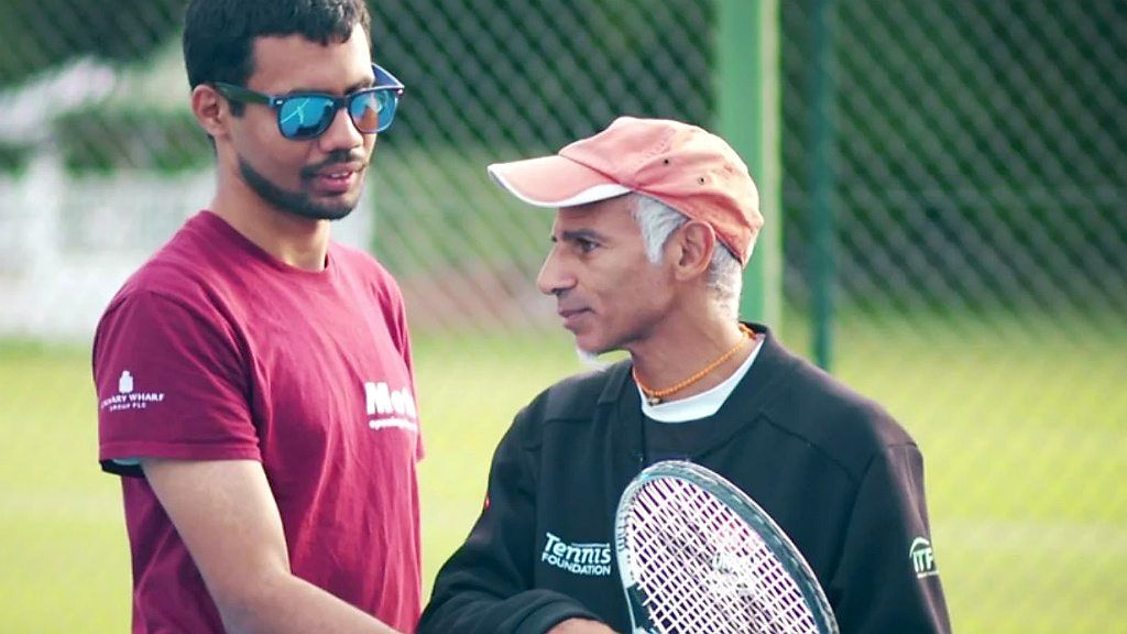 Blind tennis player and coach