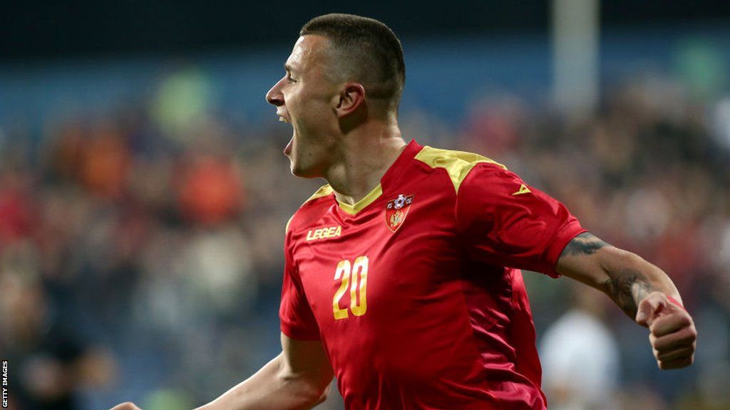 New Preston forward Milutin Osmajic scoring for Montenegro in a football match