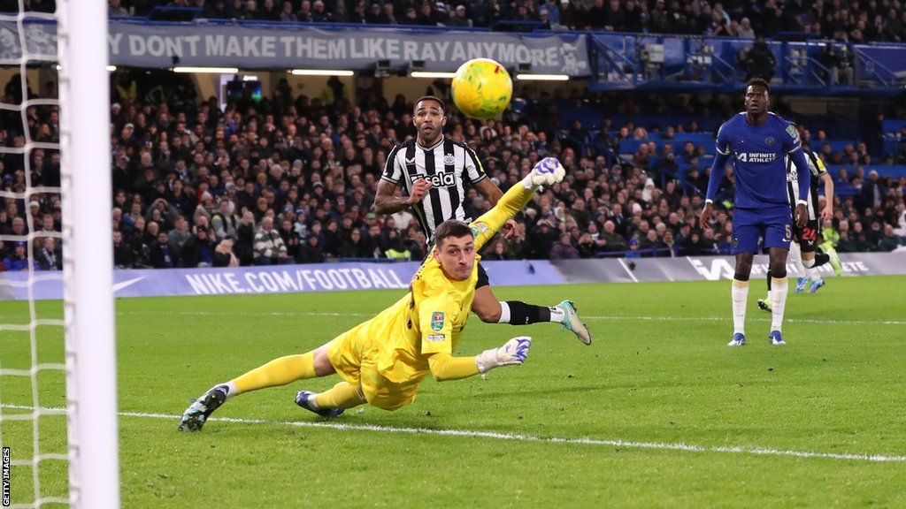 Newcastle's Callum Wilson scores against Chelsea in the EFL Cup quarter-finals