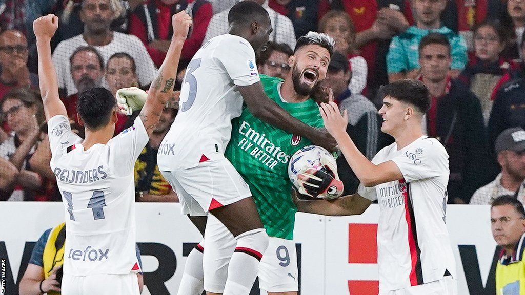 Milan celebrate their win with replacement goalkeeper Olivier Giroud