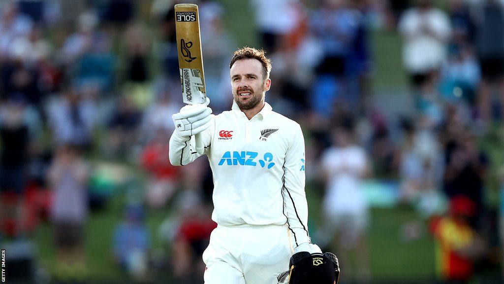 New Zealand wicketkeeper Tom Blundell raises his bat to celebrate his century in the first Test against England