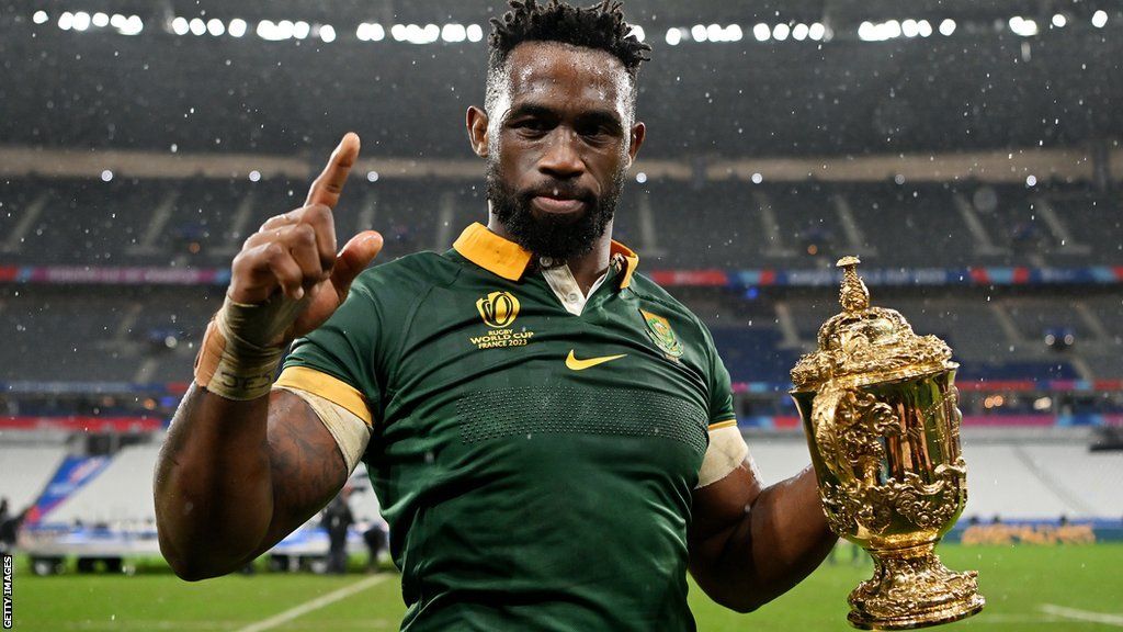 Siya Kolisi holds the World Cup trophy after South Africa's victory over New Zealand in the final