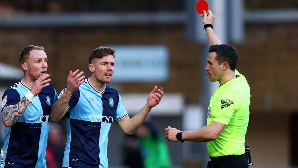 Wycombe's David Wheeler was sent off when the score was 3-2 to Barnsley