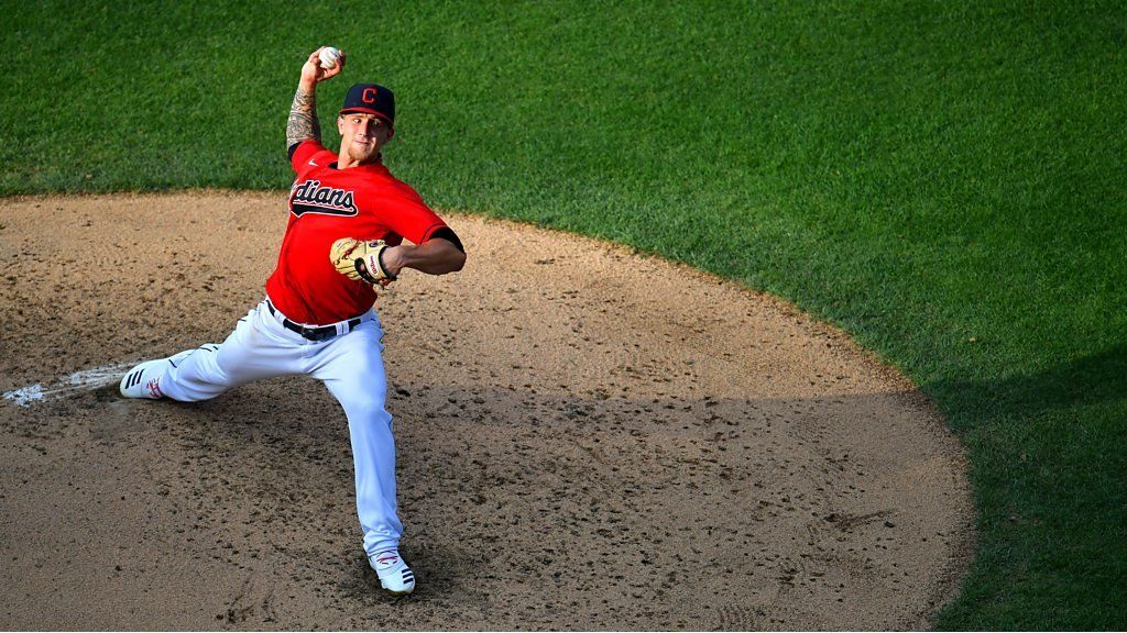 Cleveland Indians pitcher Zach Plesac catches the ball at first