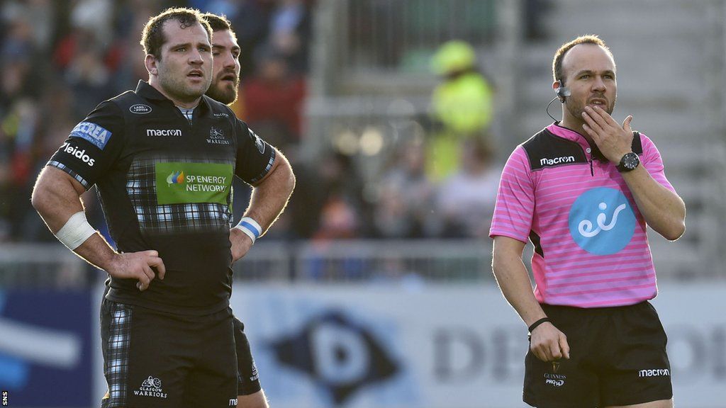 Glasgow Warriors player Fraser Brown standing next to a referee