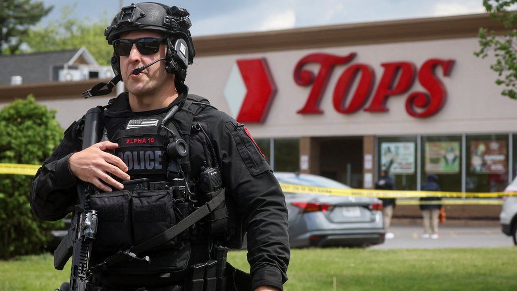 A photo of a Buffalo Police officer outside the scene of the shooting