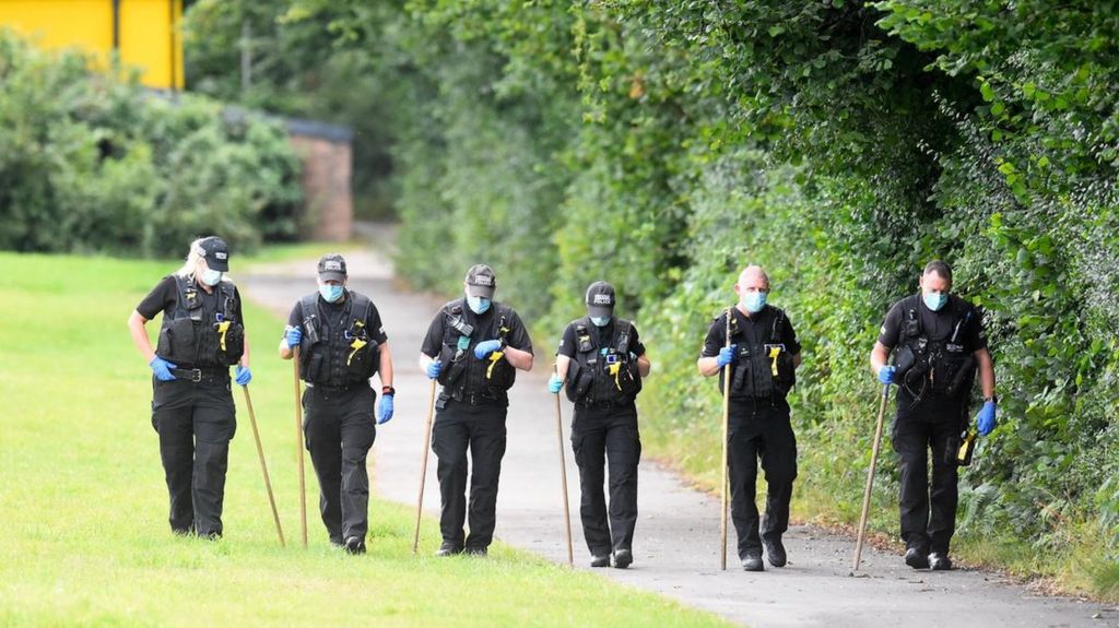 Police conduct searches at the scene