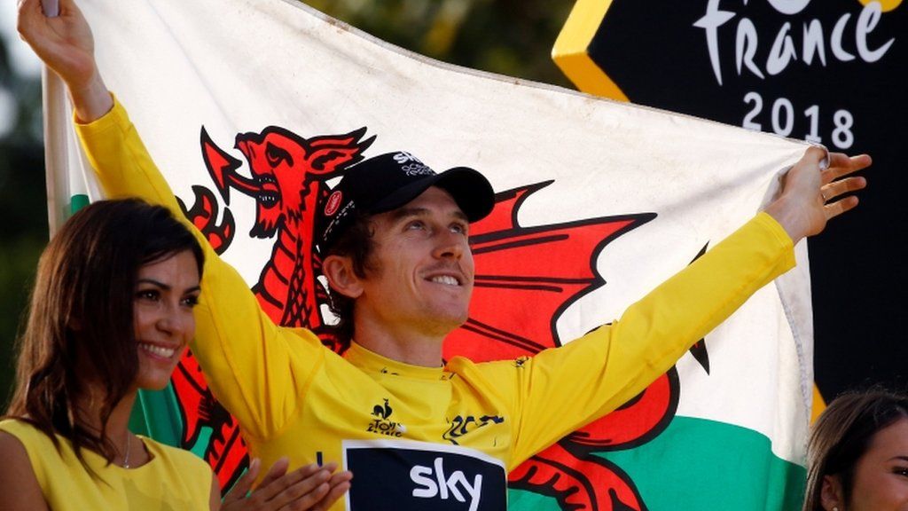 Tour de France winner Geraint Thomas holds Welsh flag aloft
