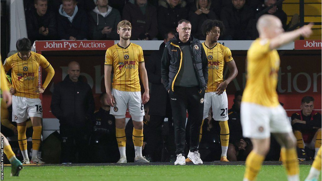 Newport manager Graham Coughlan looks on glumly as his side fall to a 3-0 loss at Notts County