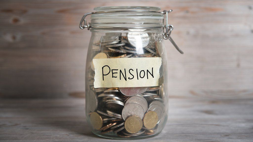 A jar of coins with a label saying pension