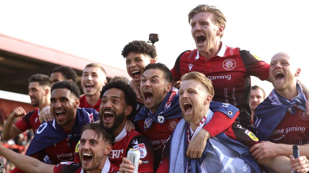 Stevenage players celebrate winning promotion