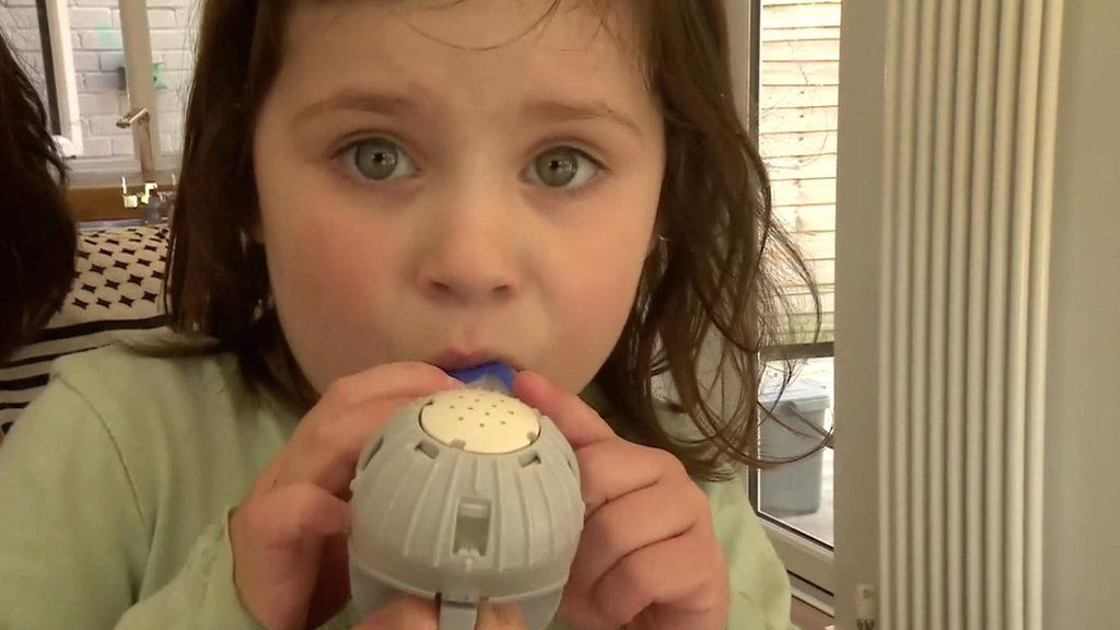 Child taking medication for Cystic Fibrosis