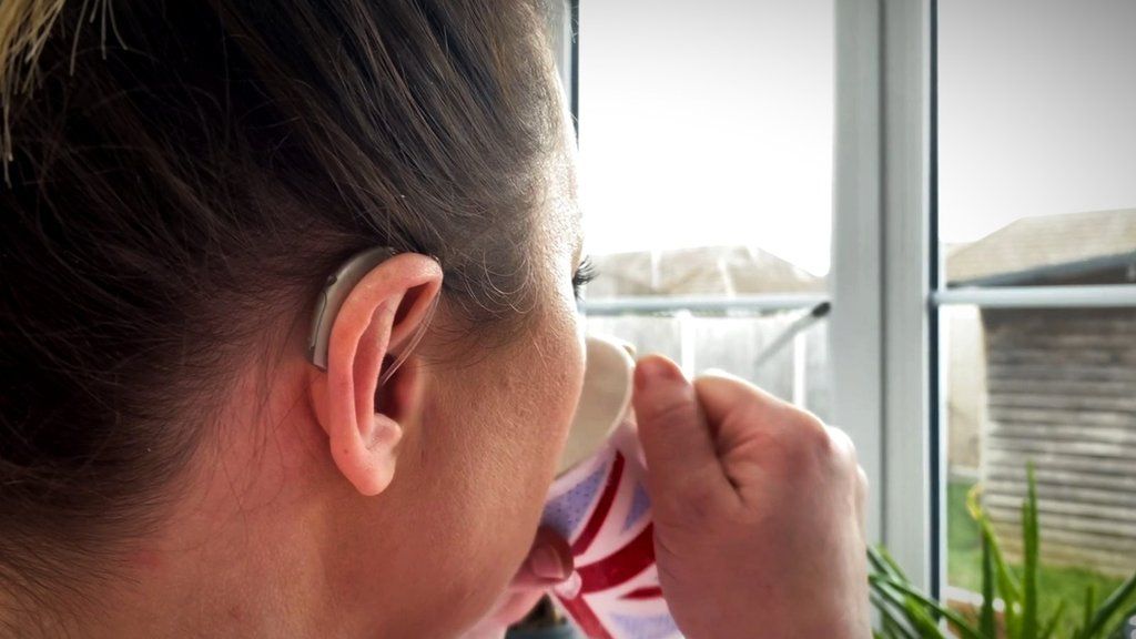 Woman wearing hearing aid