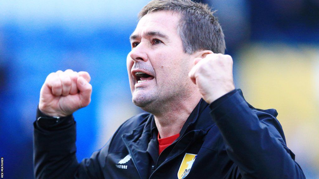 Mansfield Town manager Nigel Clough pumps his fist in celebration