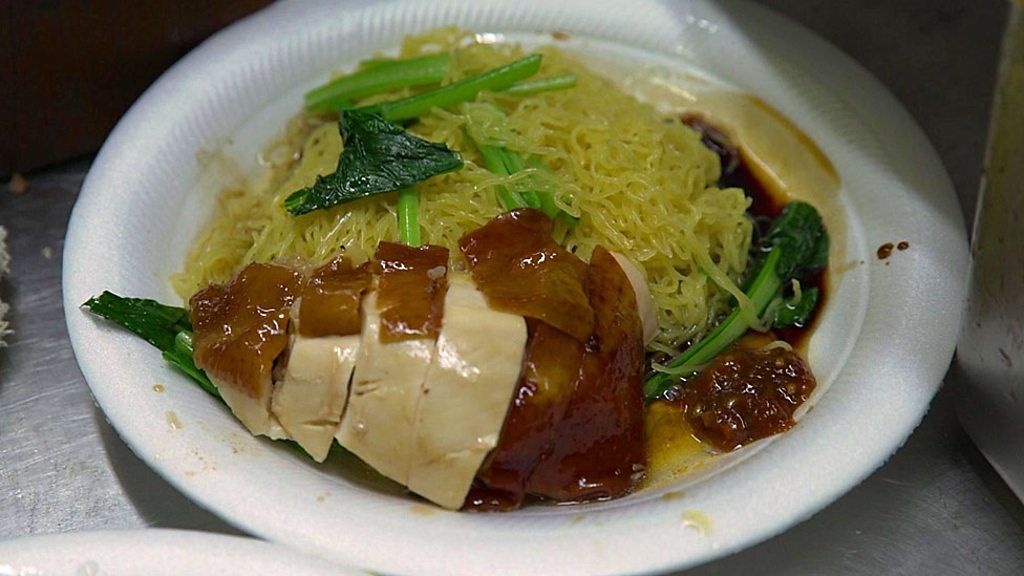 A plate of chicken with noodles