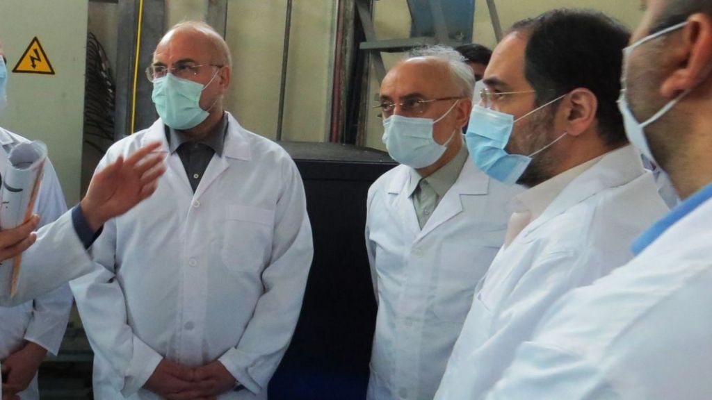 A handout photo made available by the Atomic Energy Organisation of Iran shows Iranian Parliamentary speaker Mohammad Baqer Qalibaf (L) and head of Atomic Energy Organisation of Iran Ali Akbar Salehi (2nd L) visiting the Fordo enrichment facility in Iran (28 January 2021)