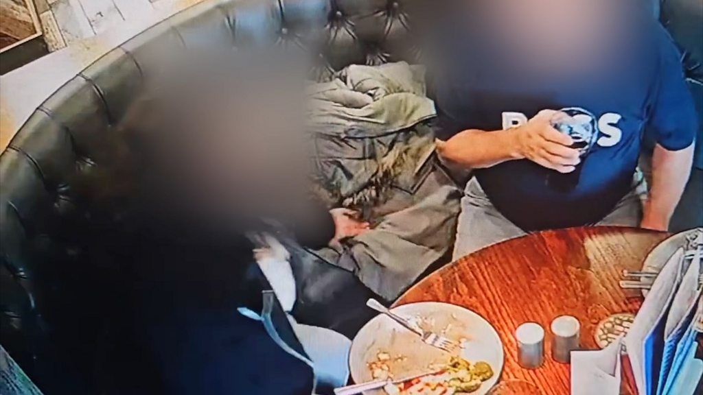 CCTV shows diner putting her hair on a plate