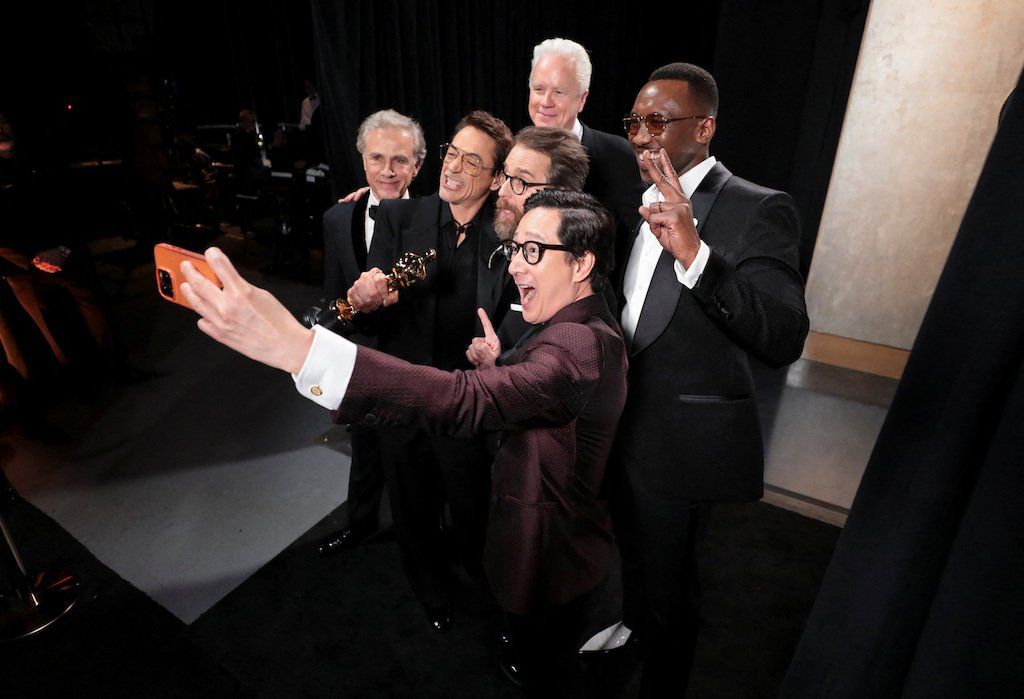 Robert Downey Jr poses with his Oscar