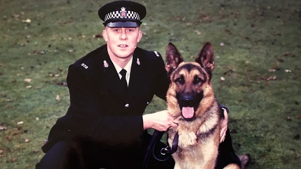 Retired PC Paul Nicholls with police dog Sabre