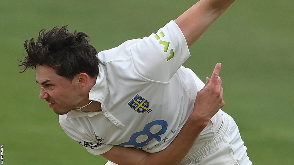 Paul Coughlin in bowling action for Durham