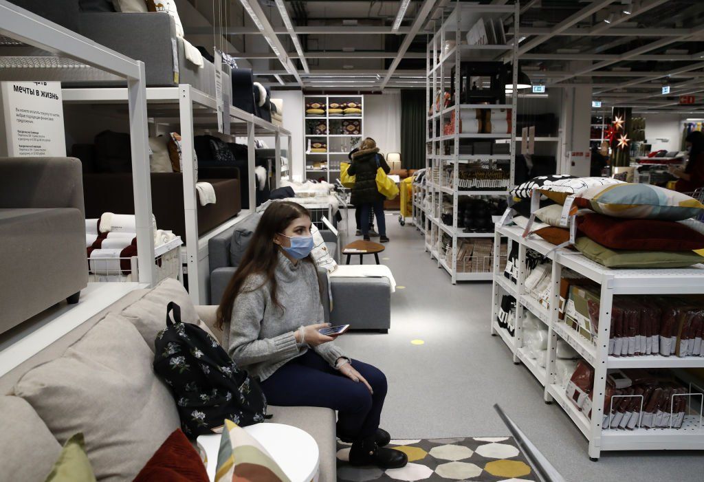 Woman sits on a sofa in a Moscow Ikea store