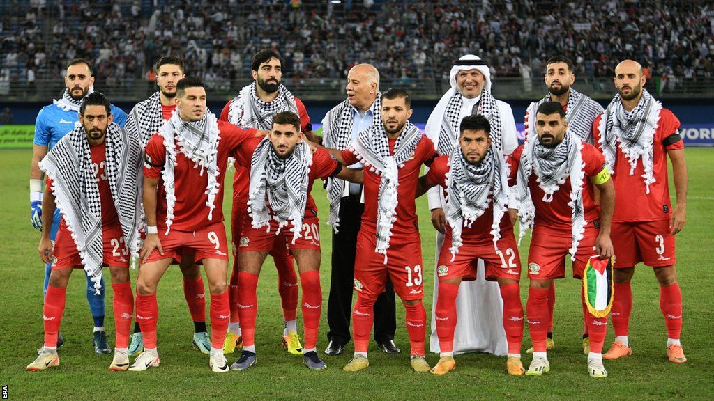 Palestine players wear a keffiyeh during the team photo ahead of their World Cup qualifier against Australia
