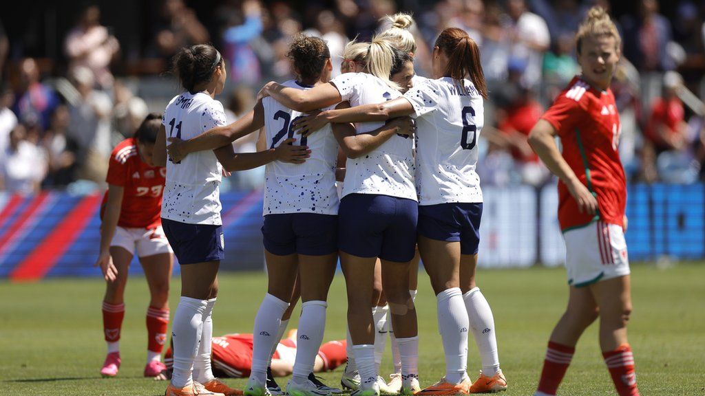 Trinity Rodman celebrates with team-mates after scoring for USA against Wales